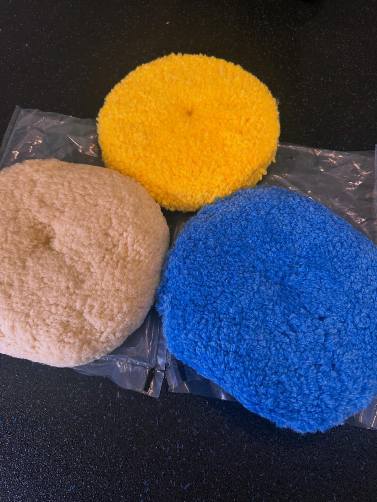 Wool and foam polishing pads ready for the job