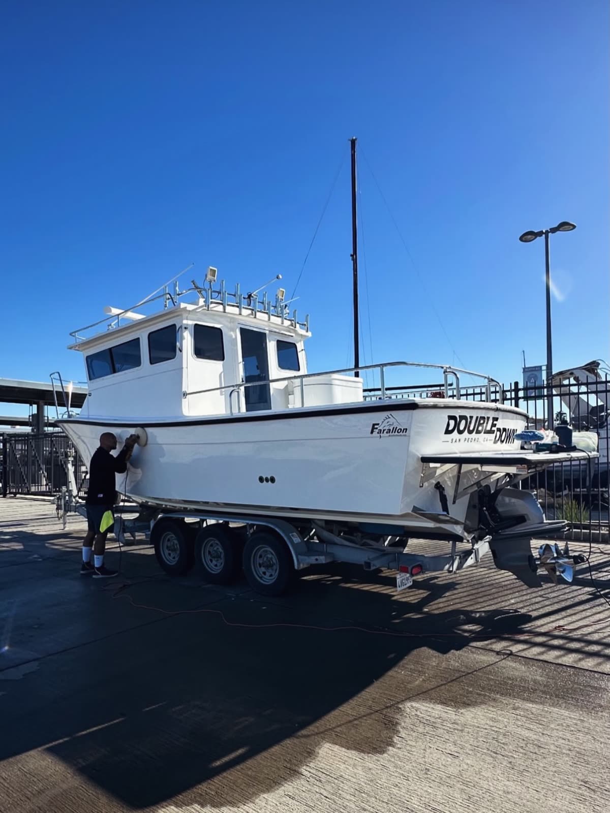 Farallon boat on its trailer under a clear blue sky